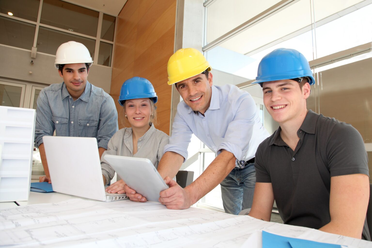 A Team of civil engineers working in an office.
