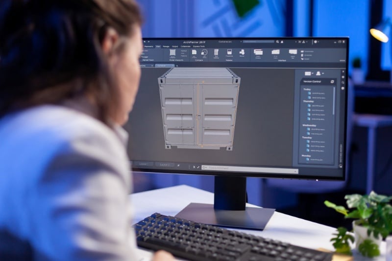 A designer using D5 Render to create a 3D visualisation of a shipping container model.