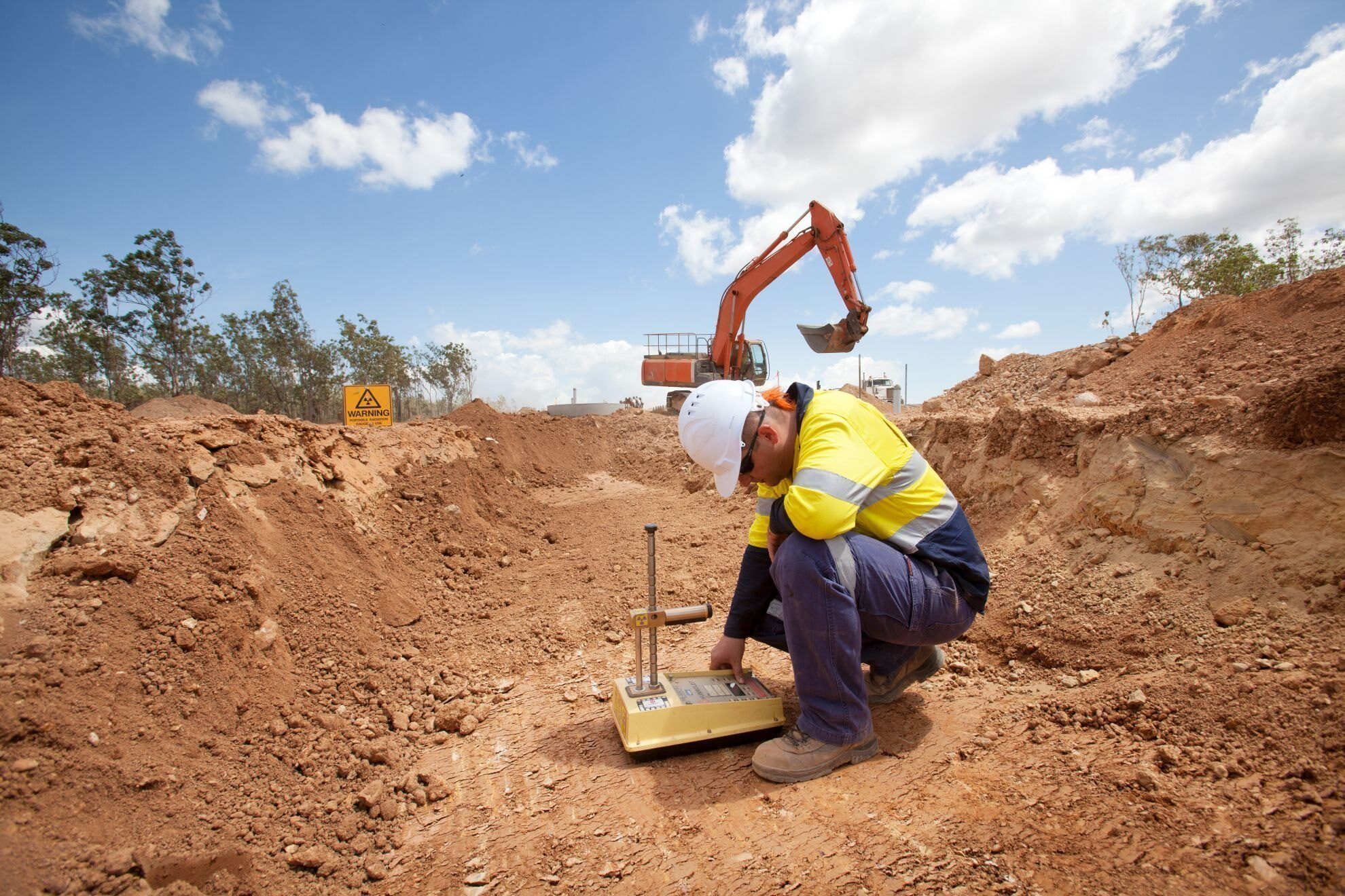 A geotechnical engineer monitoring work on site