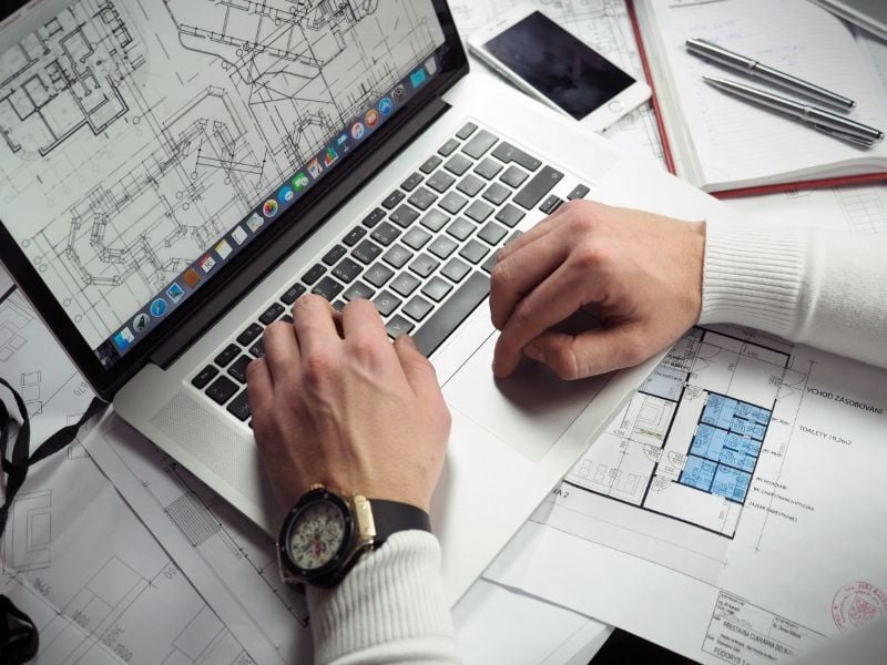 A highway engineer working on a road project draft using Trimble