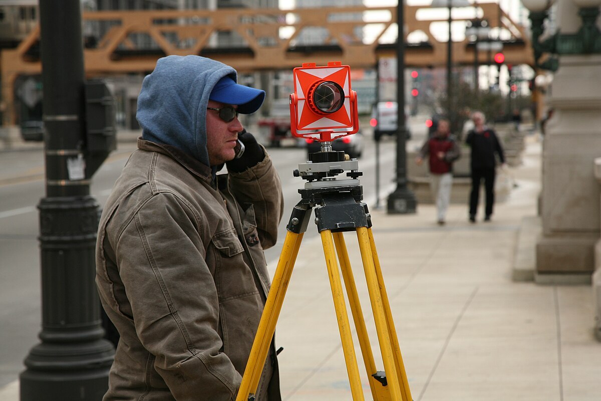 A surveyor on the streets, like the civil engineers in Nashville