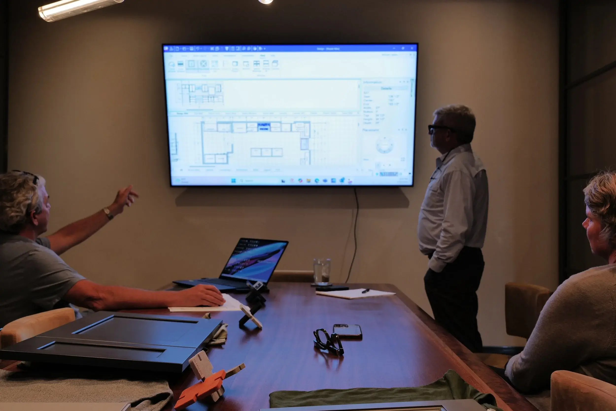 A team of BIM professionals collaborating on a project plan.