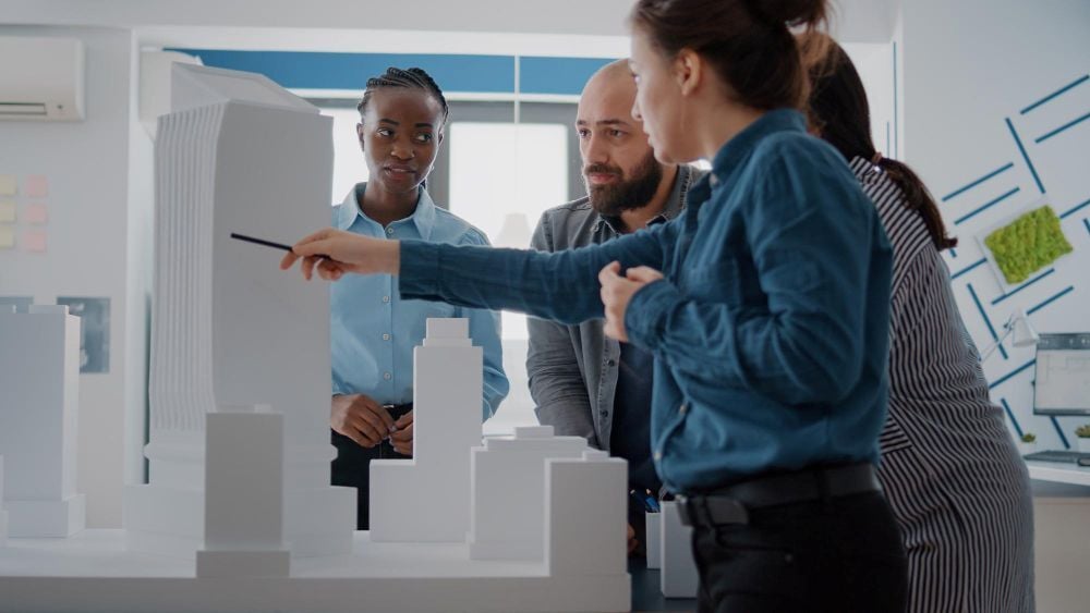 A team of facade designers analyzing a building model.