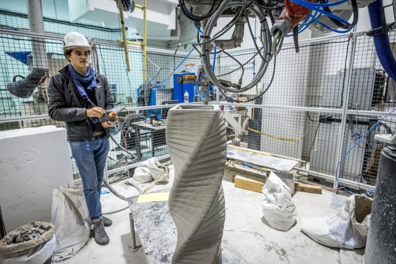 An Architect operating machinery to create a 3D printed computational design structure