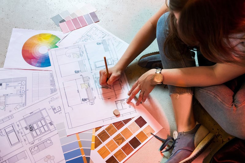 An Interior Designer working on a design plan