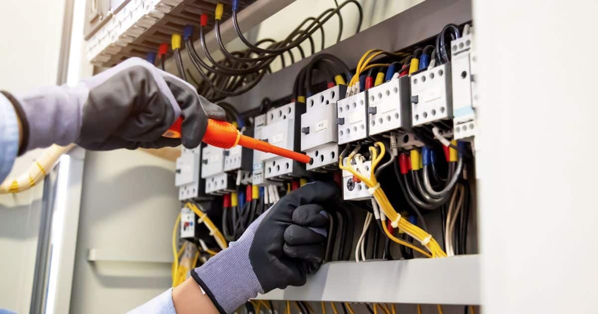 An MEP Engineer fixing an electric panel.