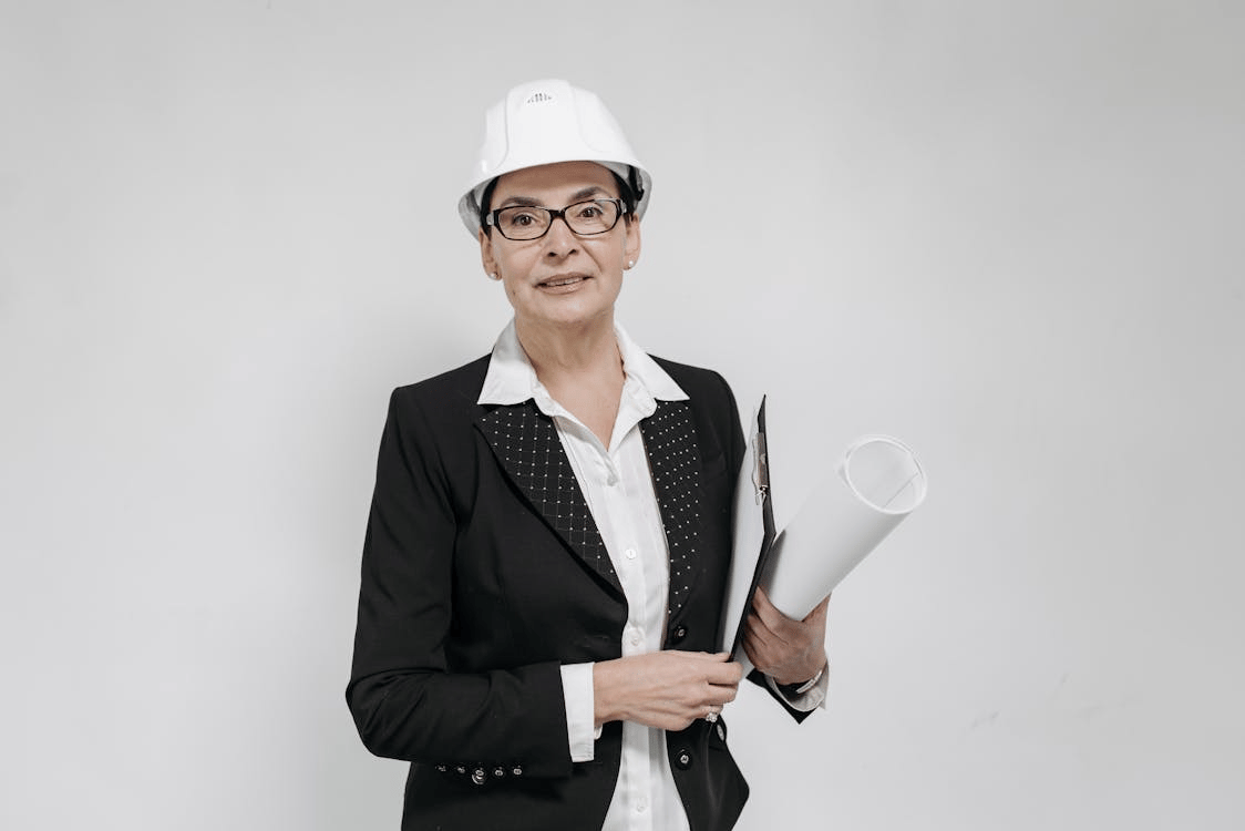 An architect holding a white project sheet