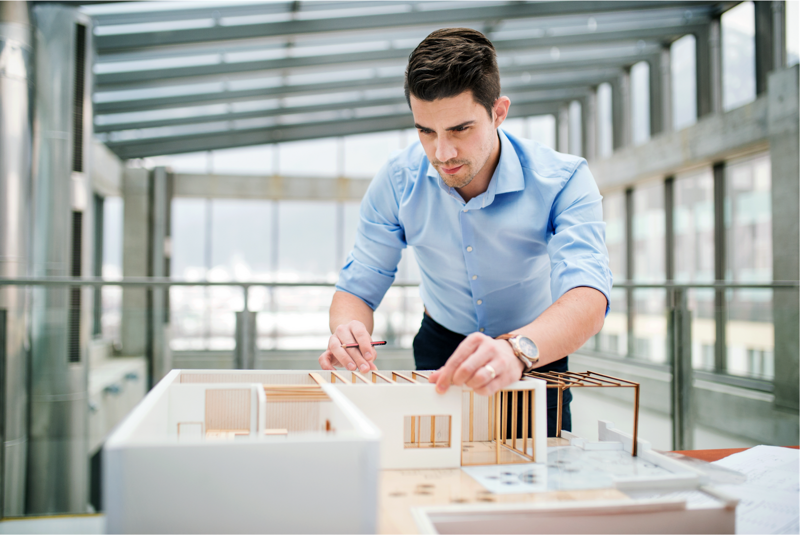 An architect working on a model