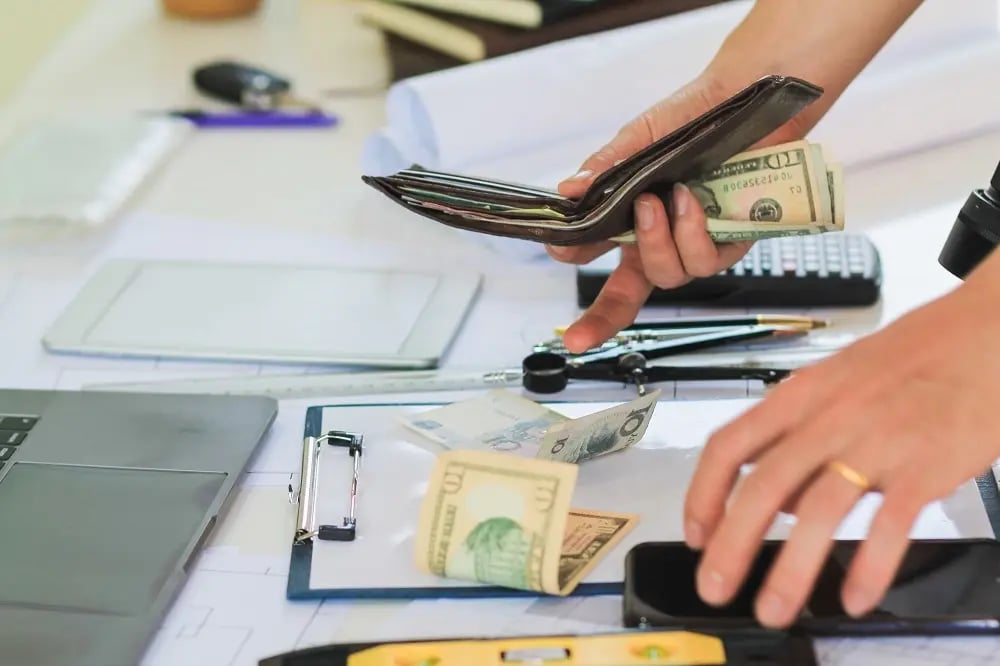 An engineer counting their money