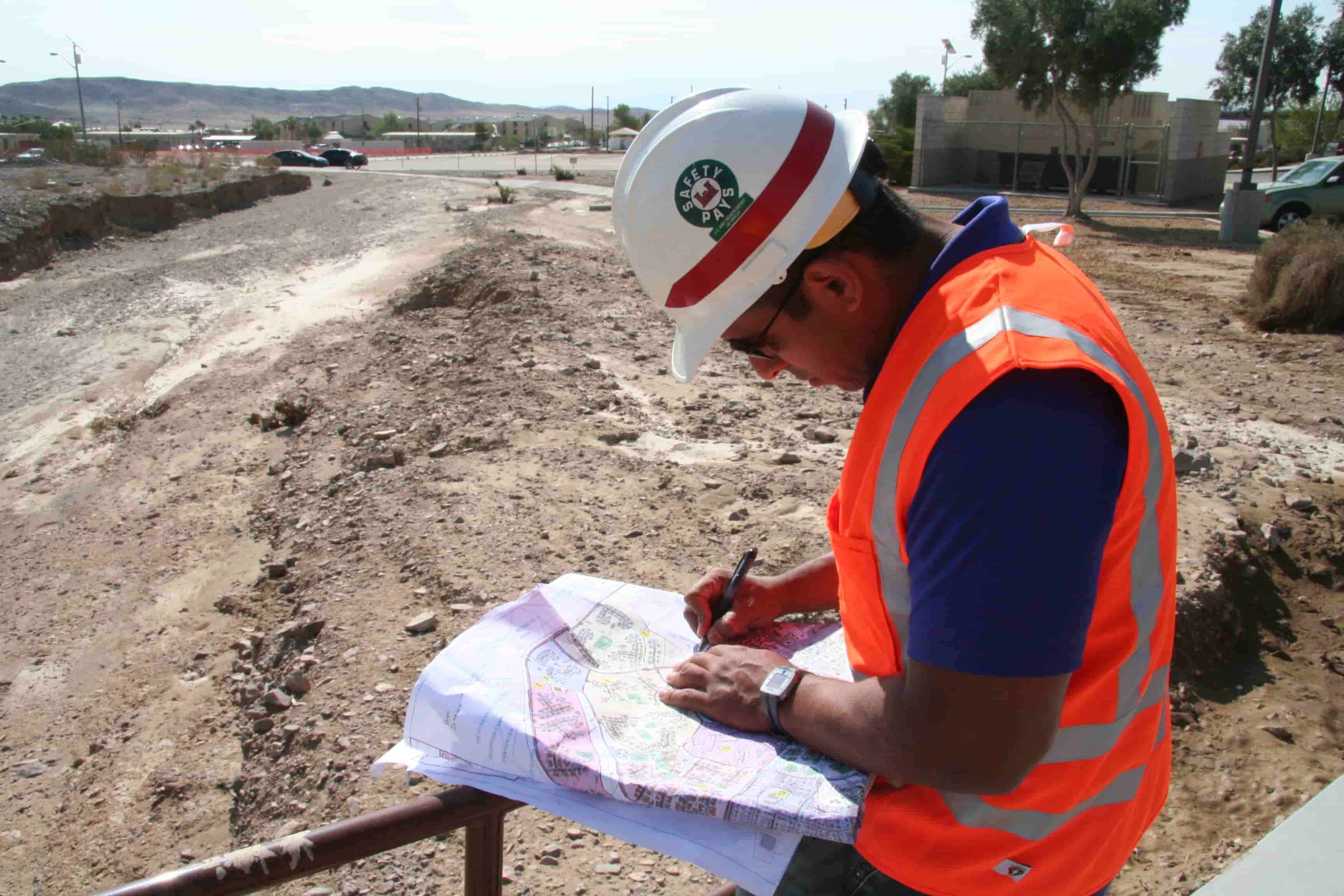 An engineer marking a project sheet on site (1)