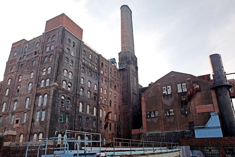 An image showing the historic brick structures of the original Domino Sugar Refinery in Brooklyn