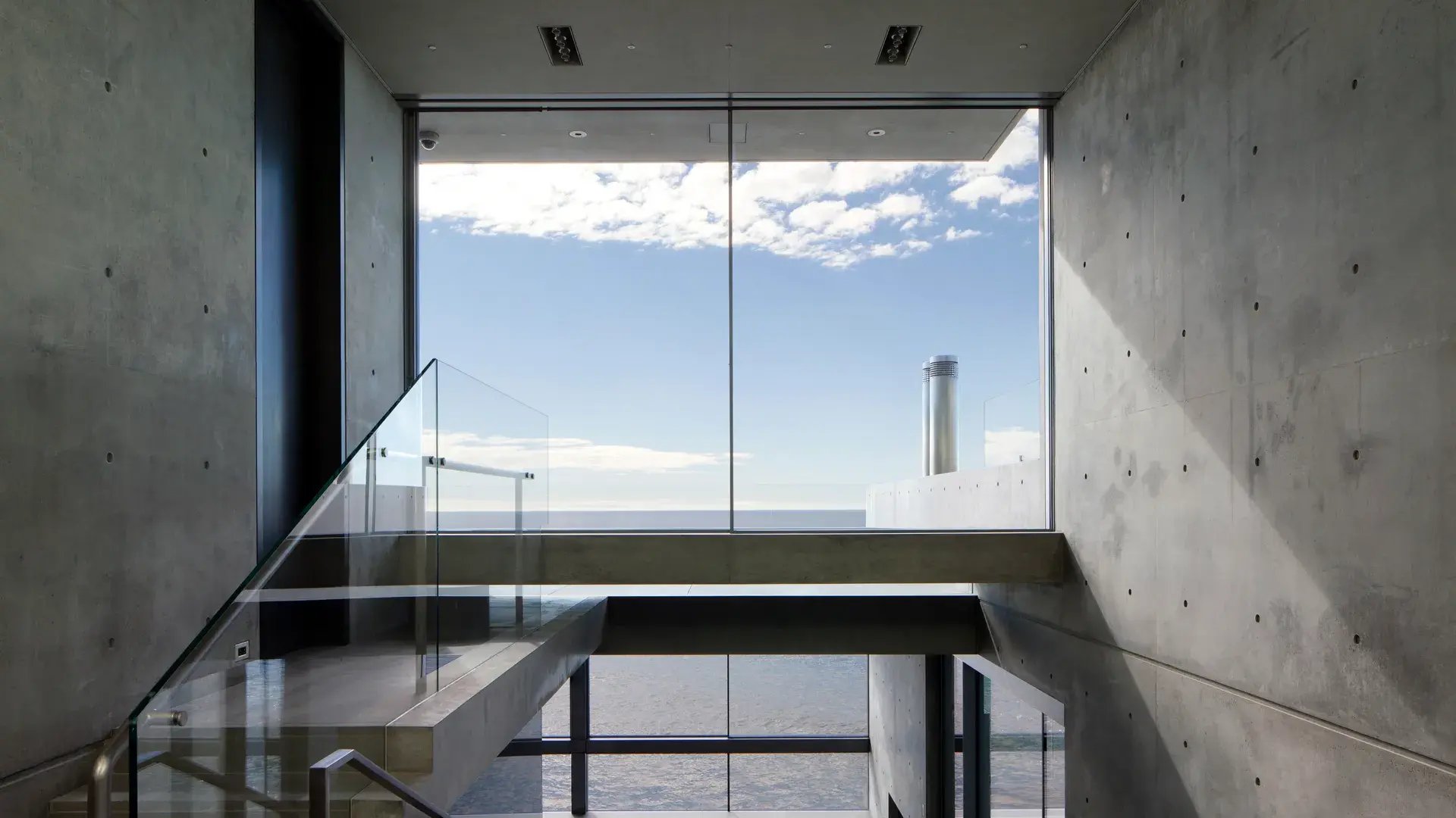 An image showing the minimalist interior of Tadao Ando’s beach house for Kanye West
