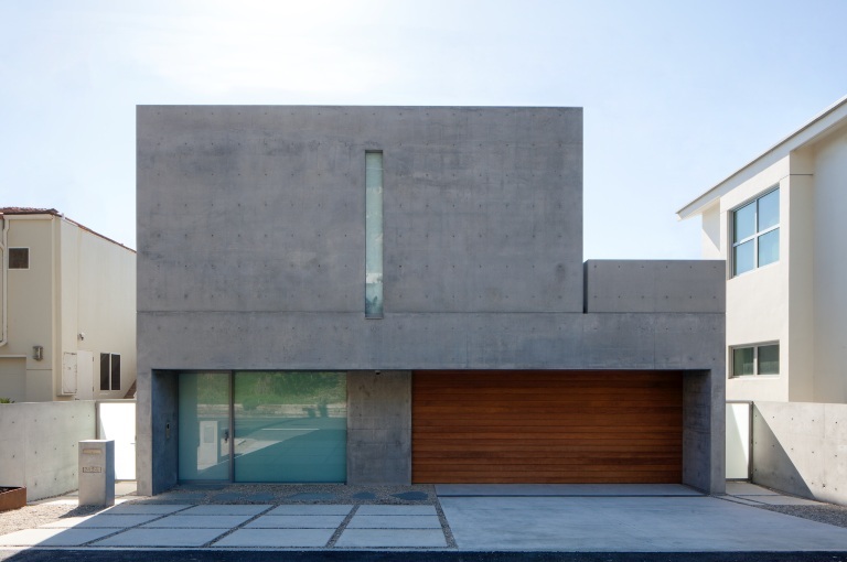 An image showing the streetfront facade of Tadao Ando’s minimalist Malibu house for Kanye
