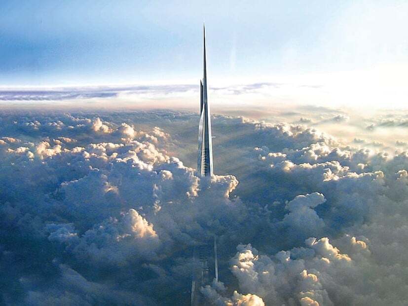 An image showing the top section of Jeddah Tower rising above a dense cloud layer