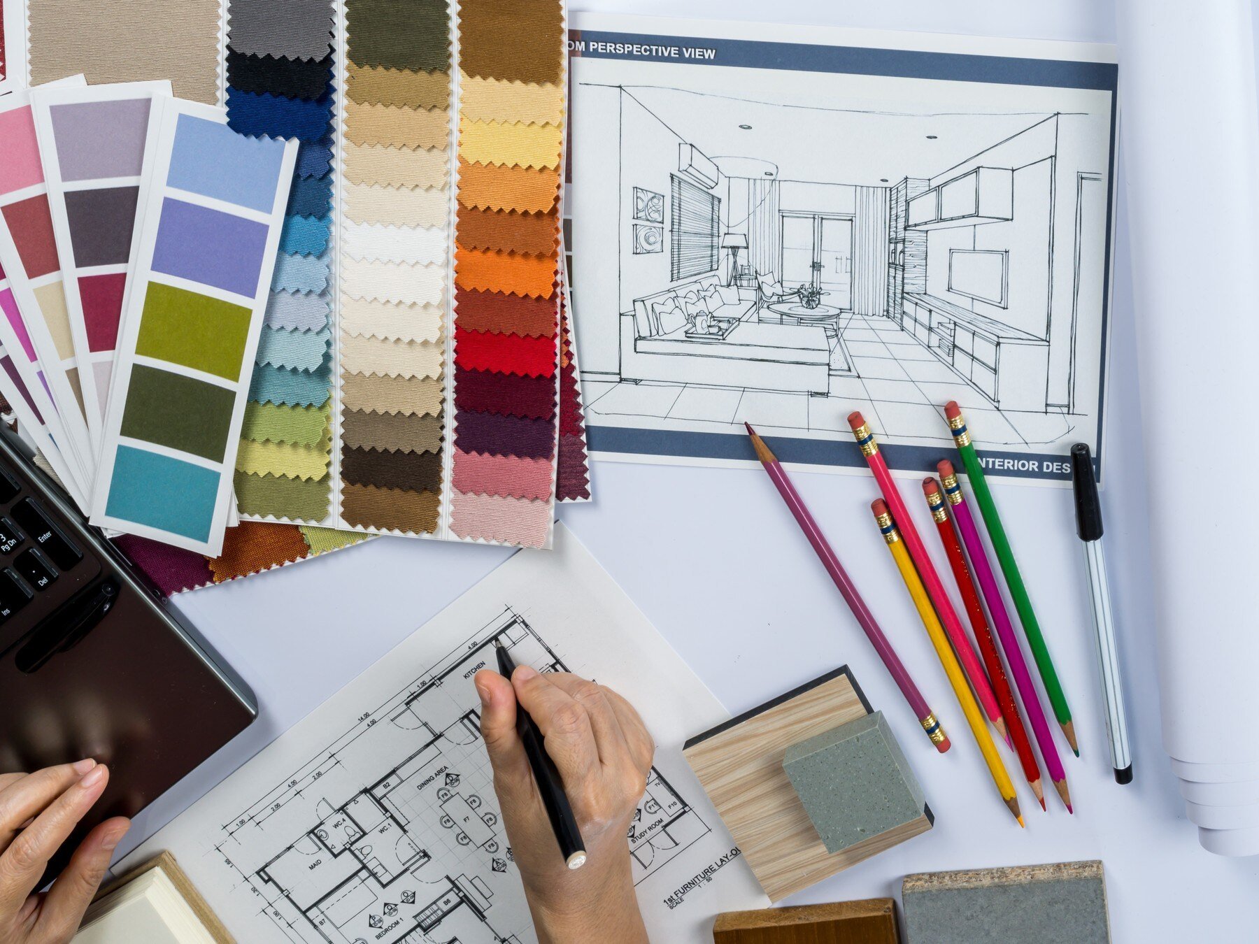 An interior designer drawing a floor plan