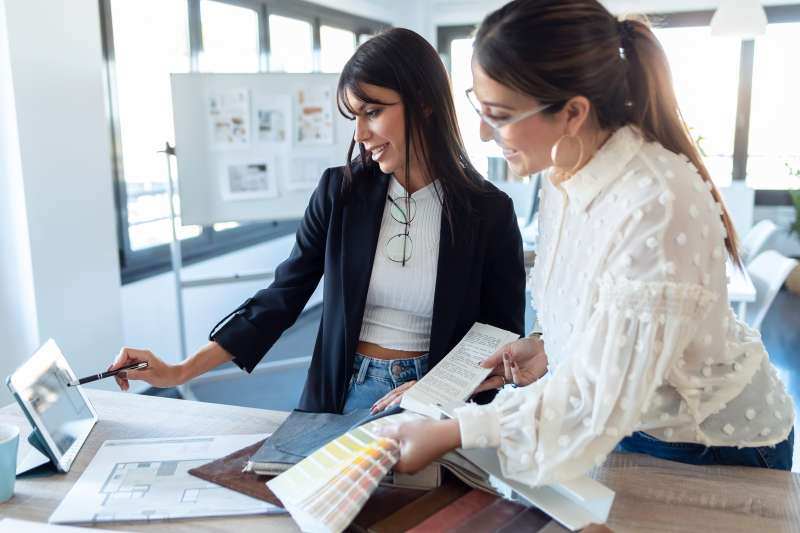 An interior designer showcasing their presentation to a client