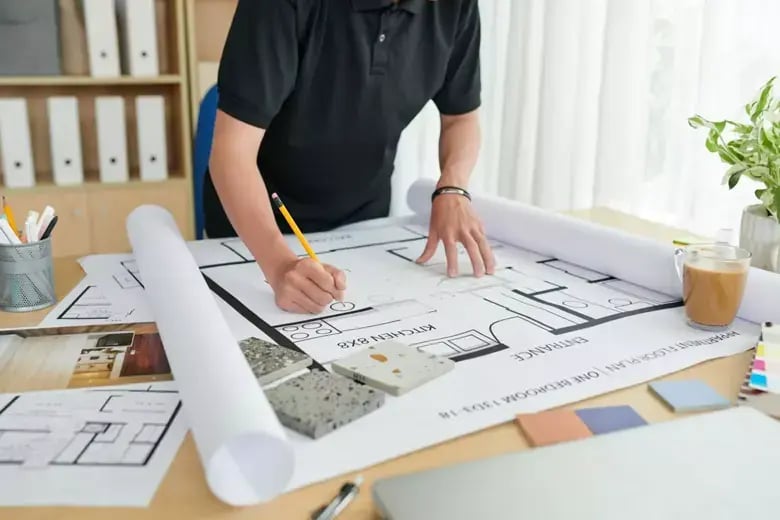 An interior designer sketching on a sheet