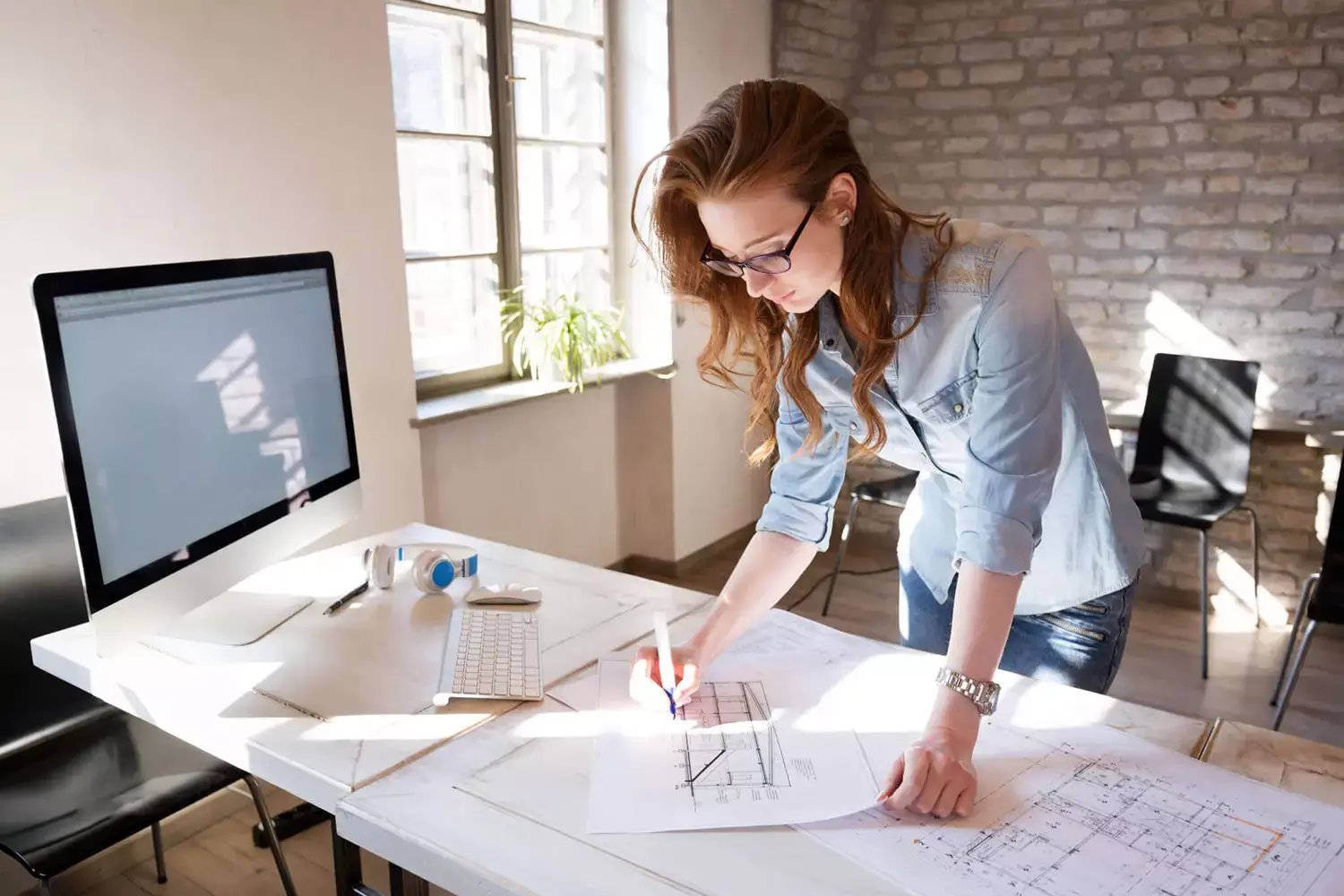 An interior designer working in their studio