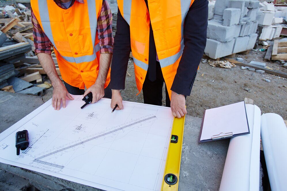 Architects and civil engineers reviewing the architectural plan