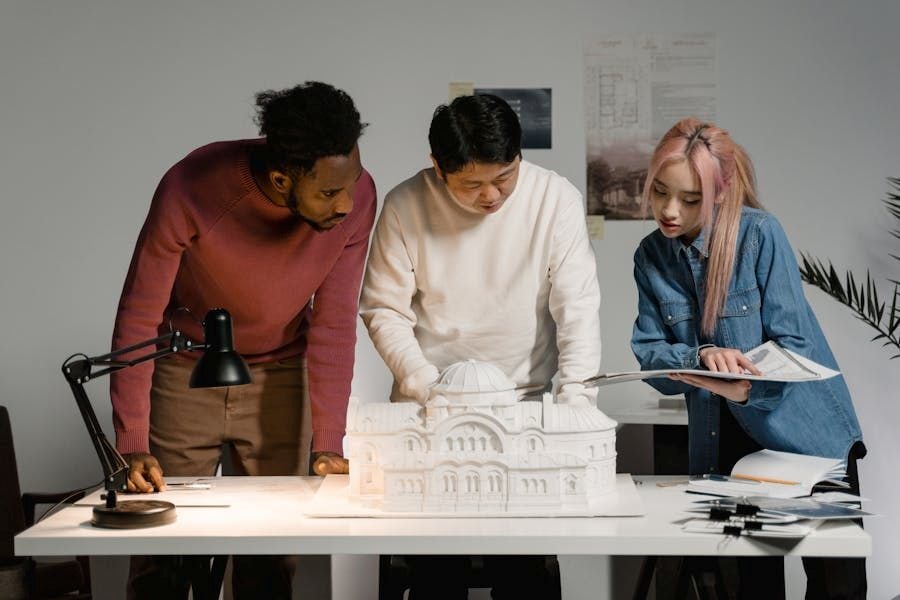 Architects collaborating on a building model
