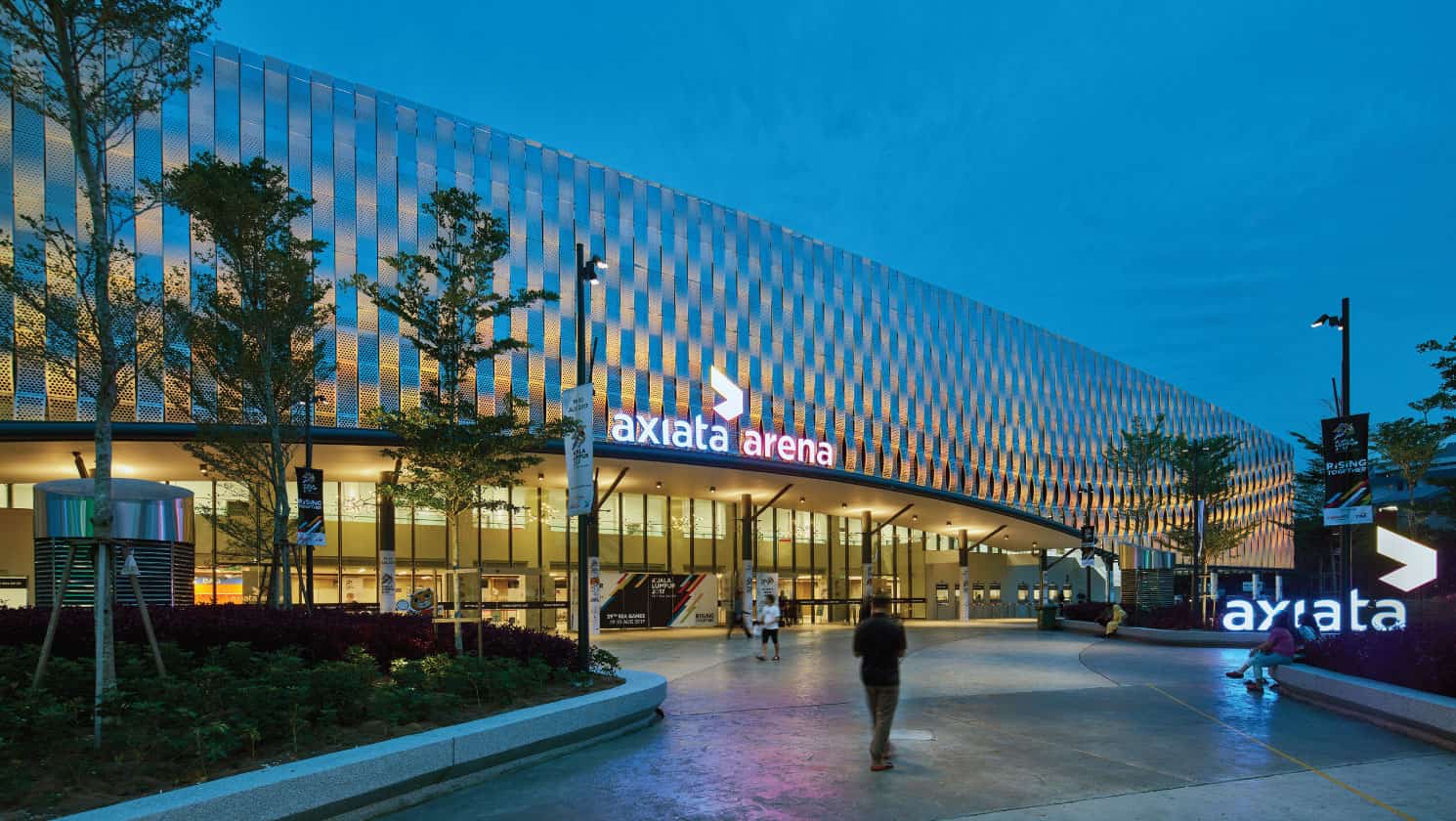 The exterior and the entrance of Axiata Arena in Kuala Lumpur at dusk
