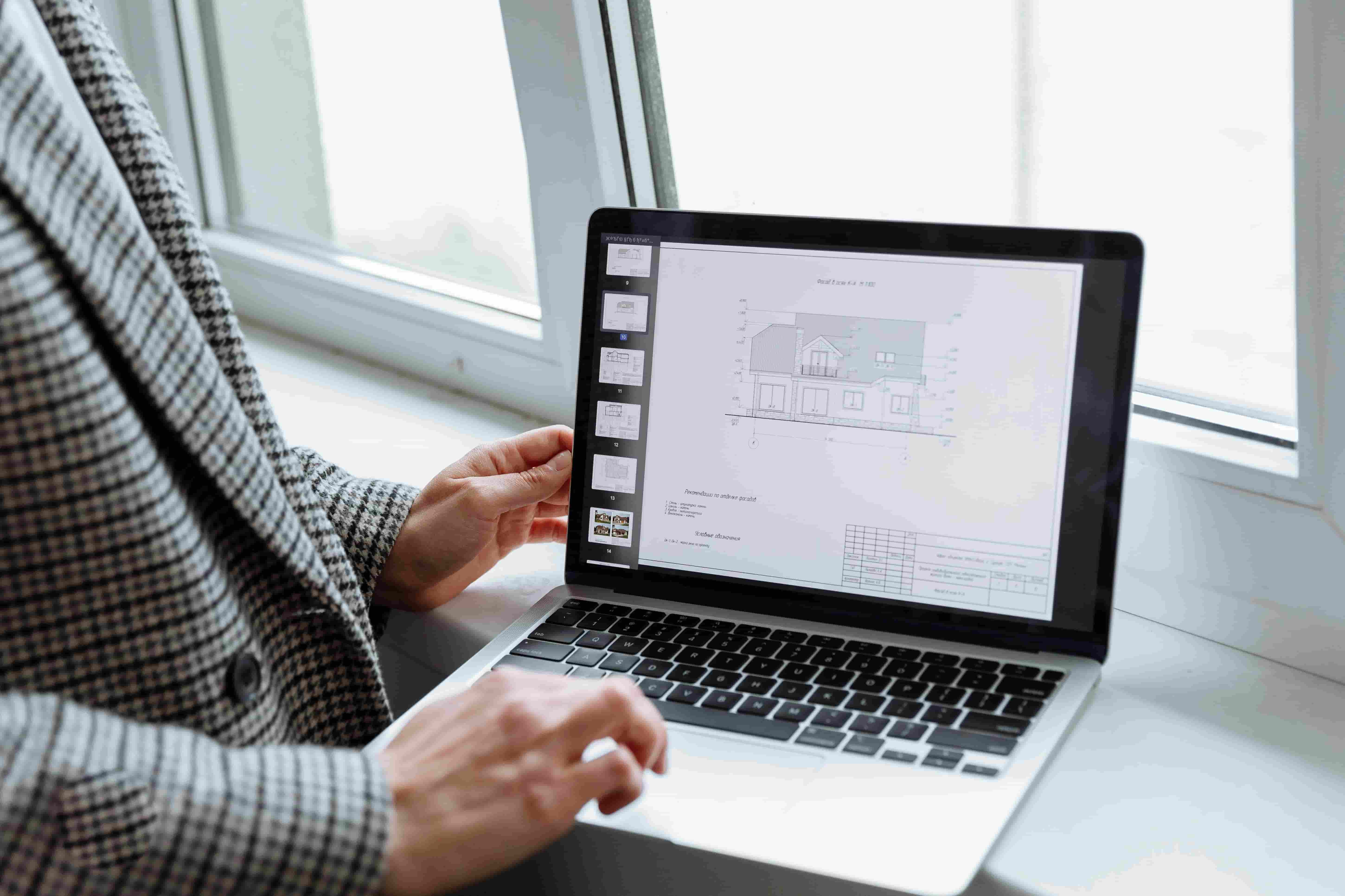 BIM Modeler analyzing a construction project using BIM software