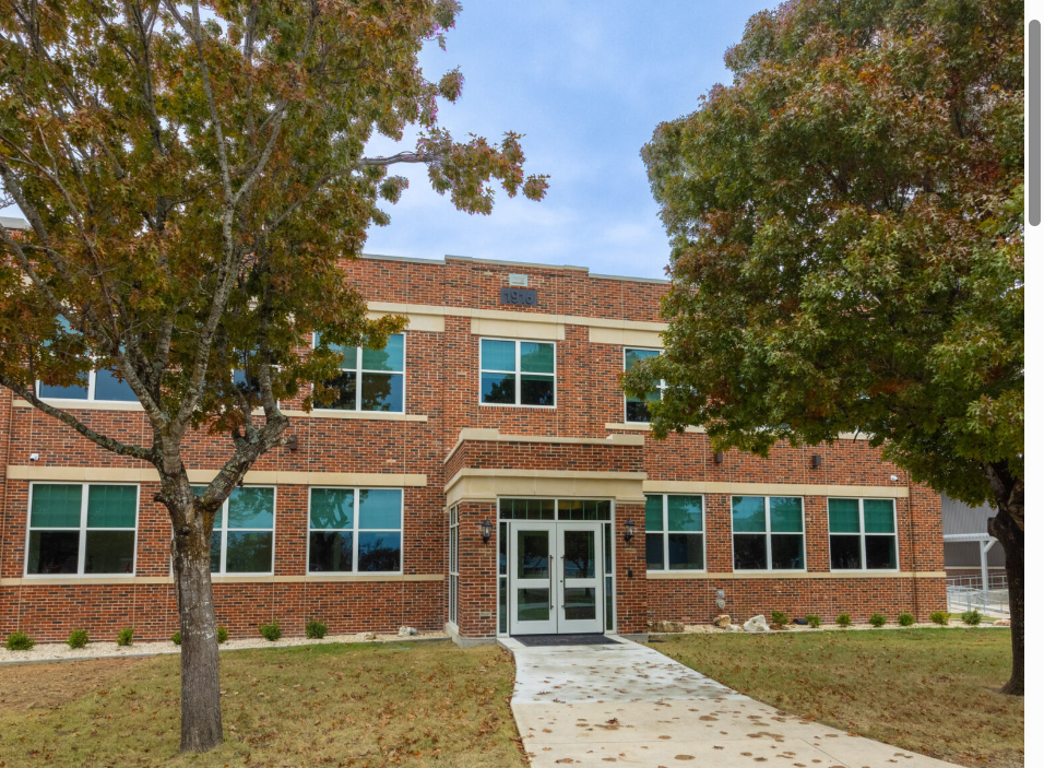 Brick School Building With Trees