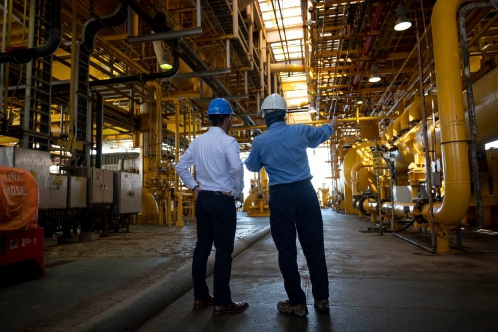 Civil Engineers making plans at a project site