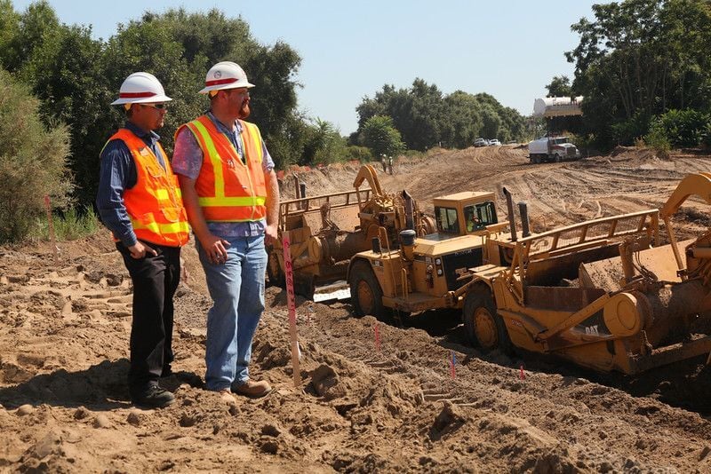 Civil Engineers reviewing the site of a construction with work in progress in North Carolina