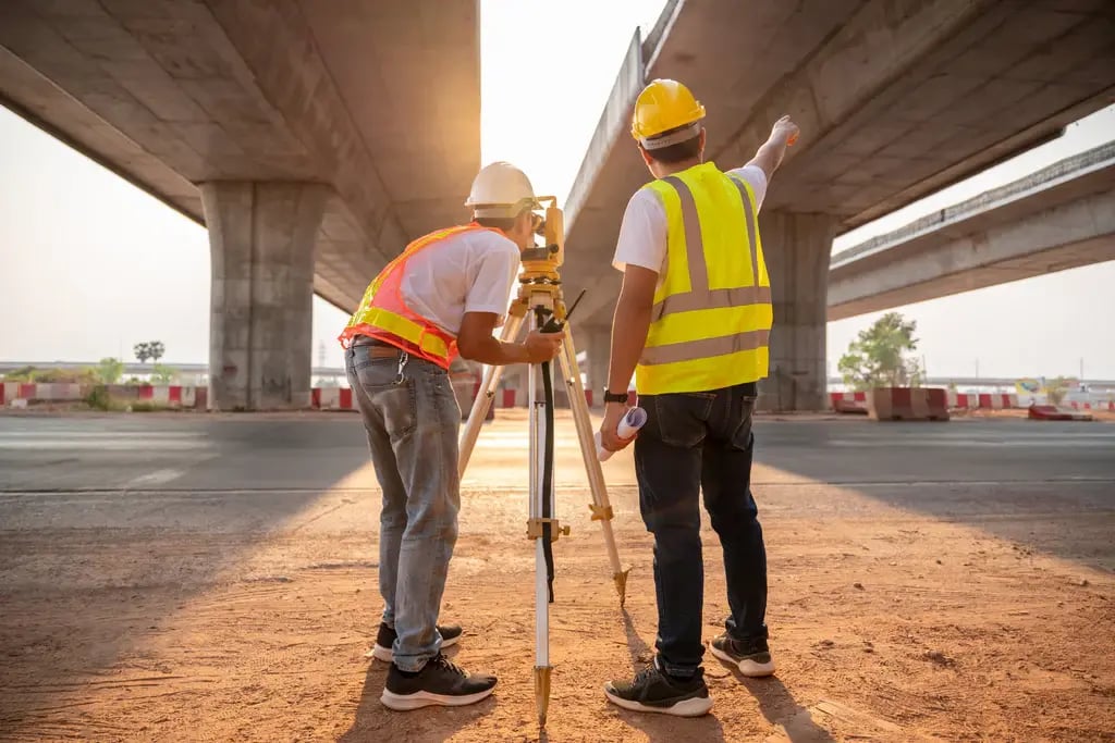 Civil engineers observing a bridge construction