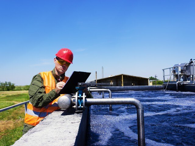 Civil engineers reviewing the water supply at a site