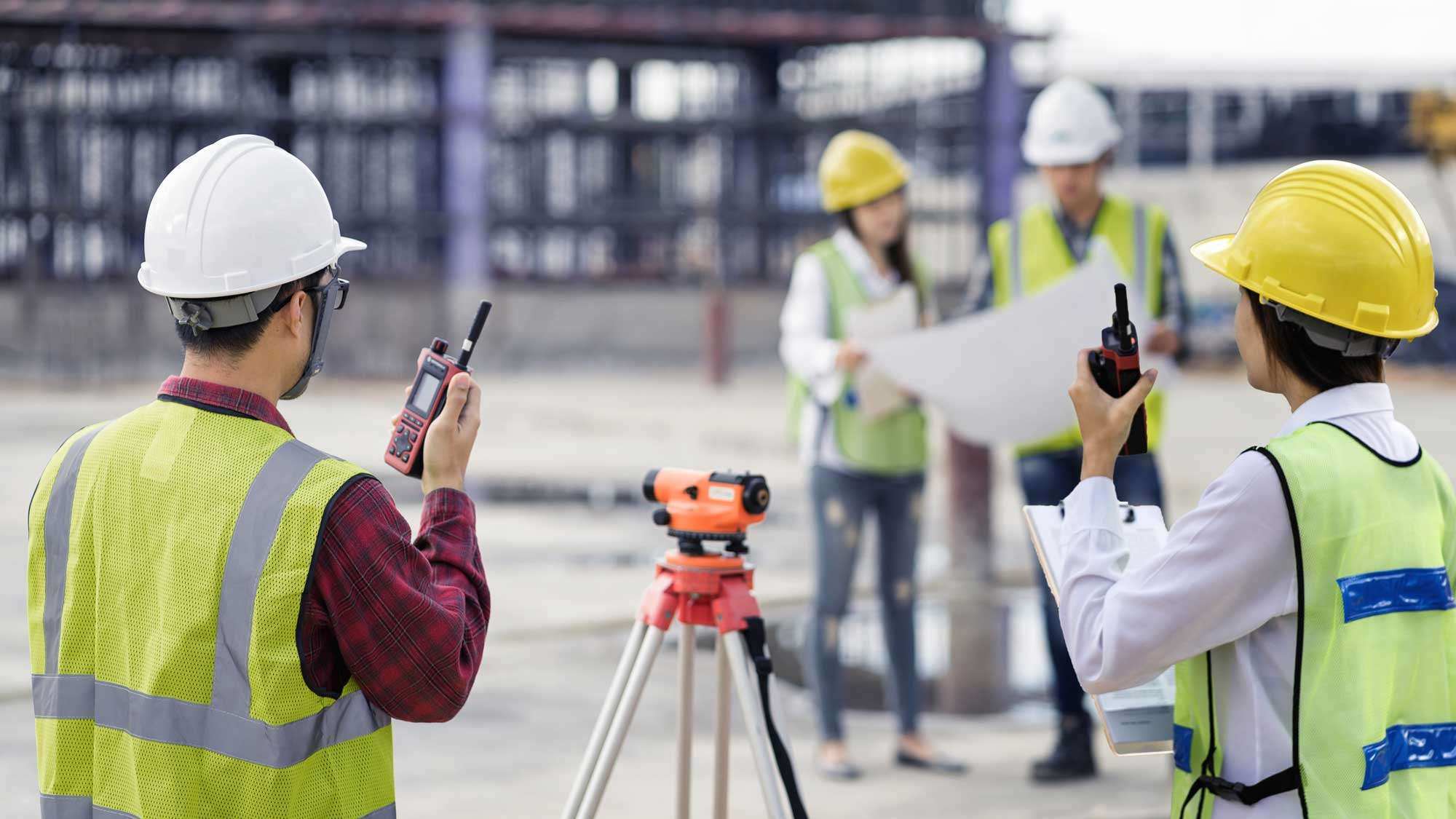 Civil engineers surveying the construction site