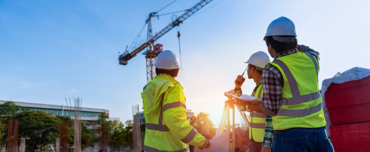 Civil engineers surveying the construction site