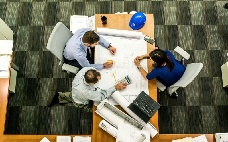 Civil engineers working on a building plan