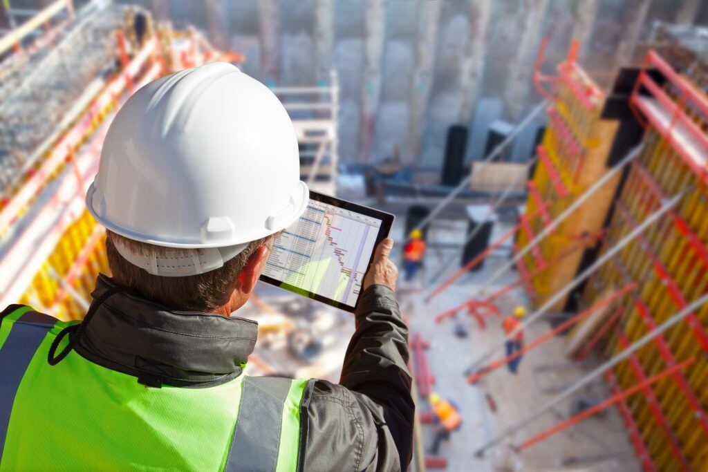 Construction engineering checking the project progress