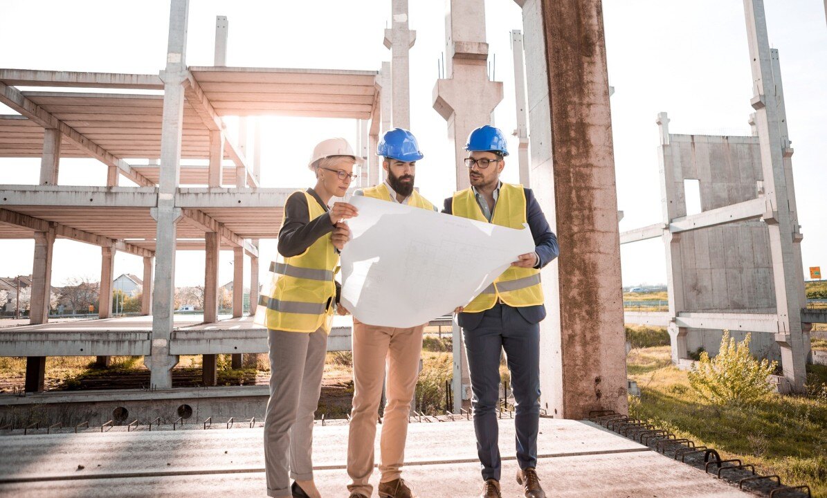 Construction engineers assessing a drawing