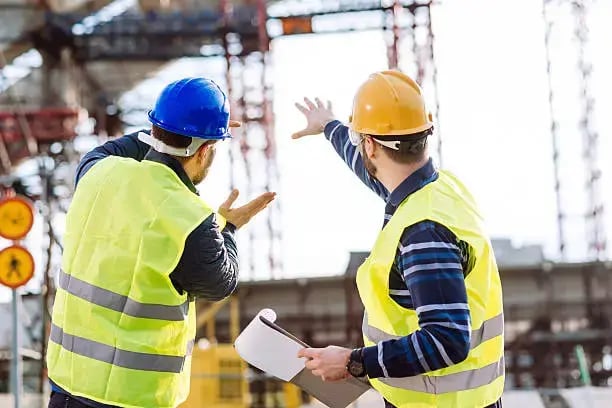 Construction engineers mapping site safety