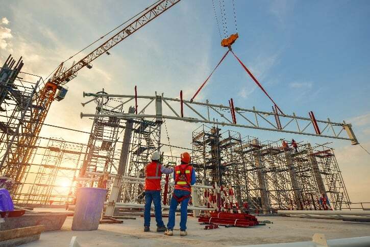 Construction engineers supervising design execution