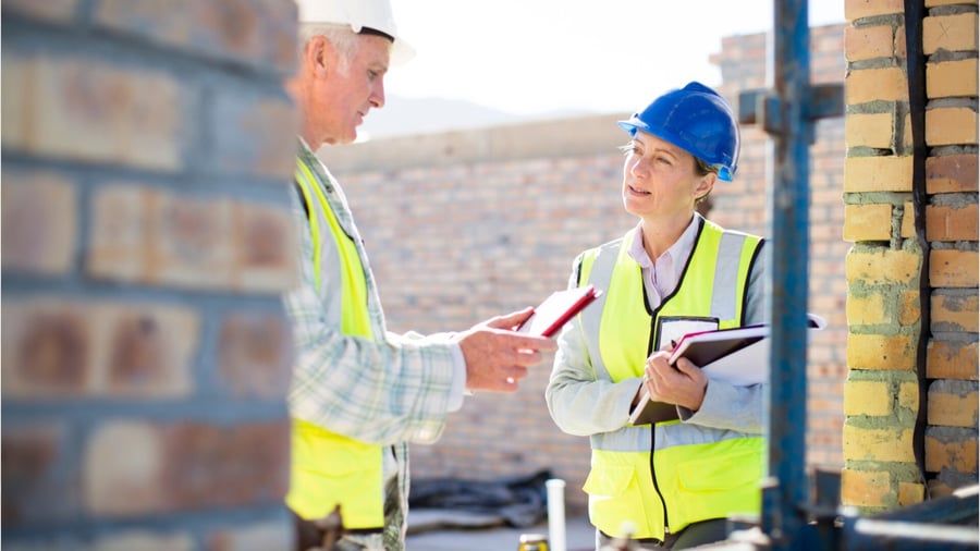 Construction inspectors at work discussing project