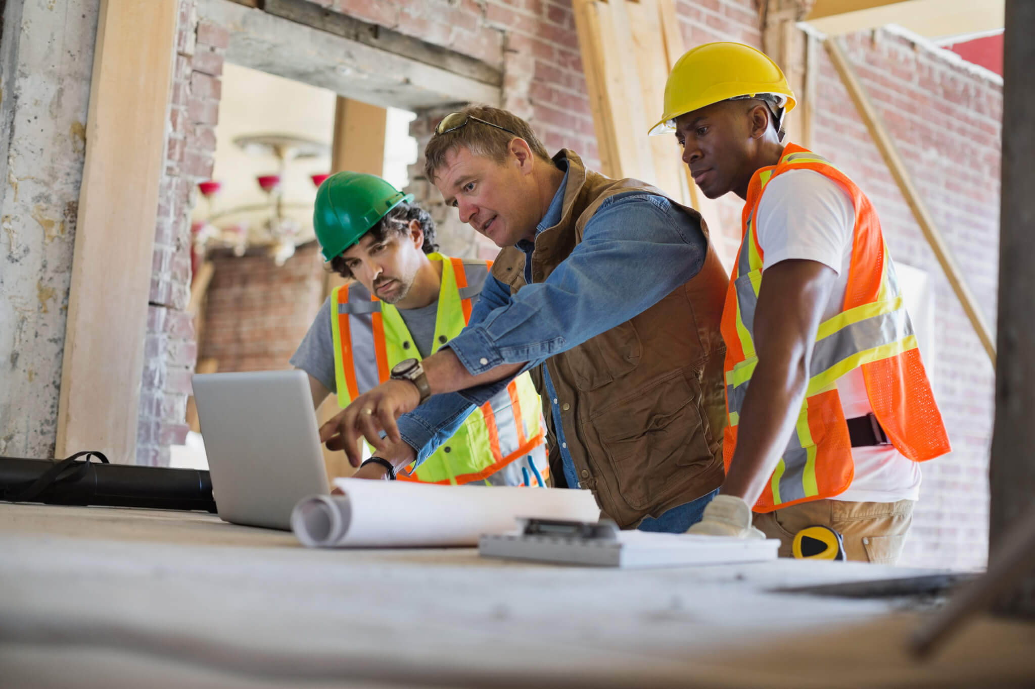 Construction inspectors evaluating a design using software