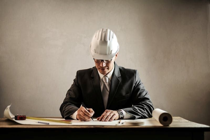 Construction professional documenting site progress