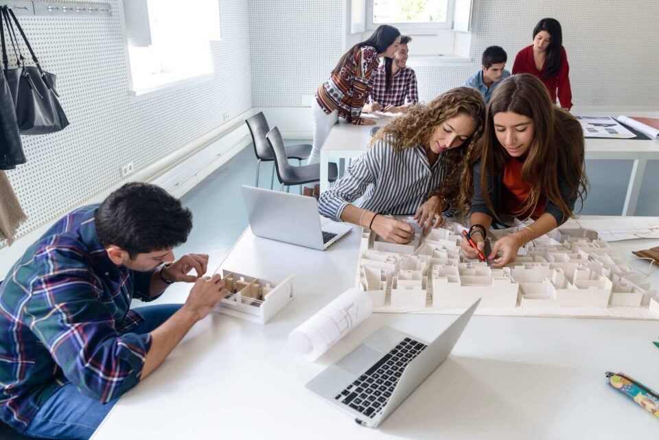 Design students working on a model