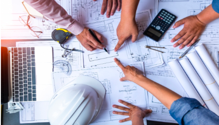 Discussion over construction drawings in office