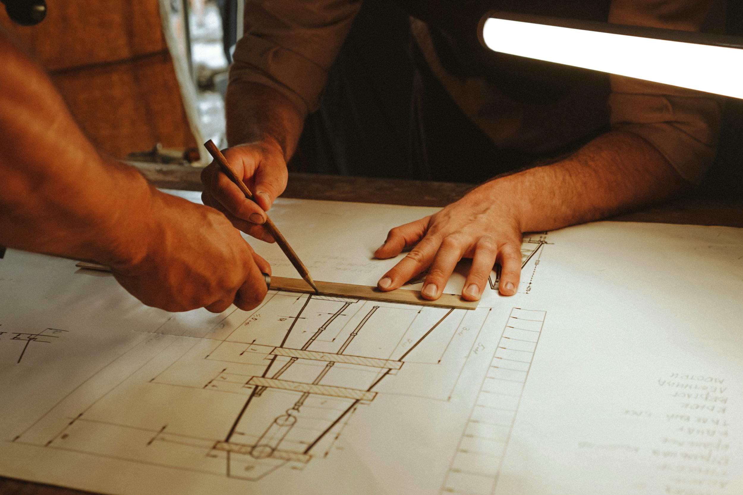 Drafters working on floor plans