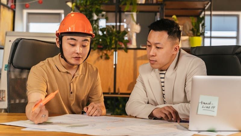 Engineers discussing construction plans