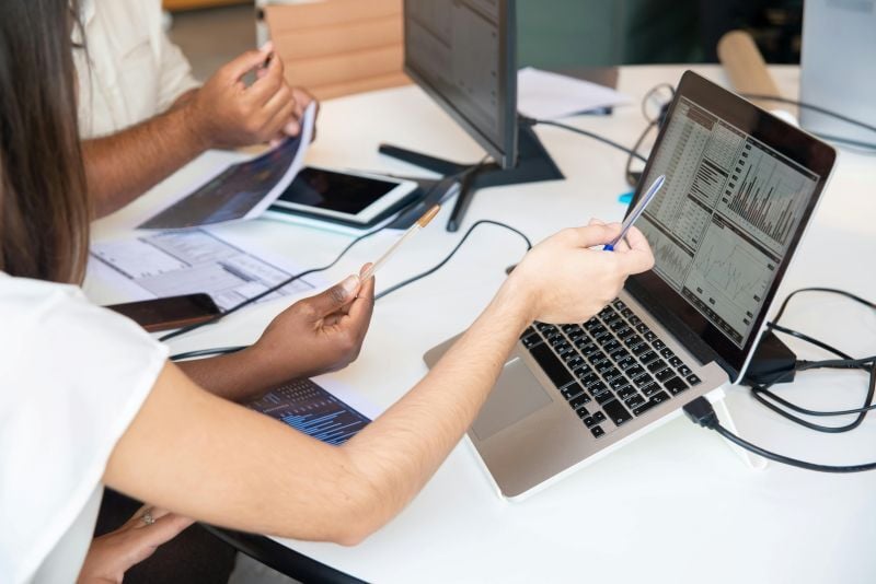Engineers estimating project budget with charts using Cubit by Buildsoft software