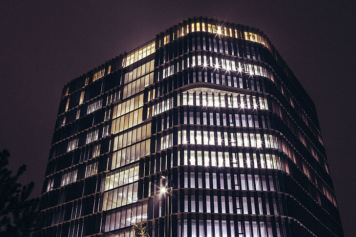 Futuristic BIM-enabled office tower at night