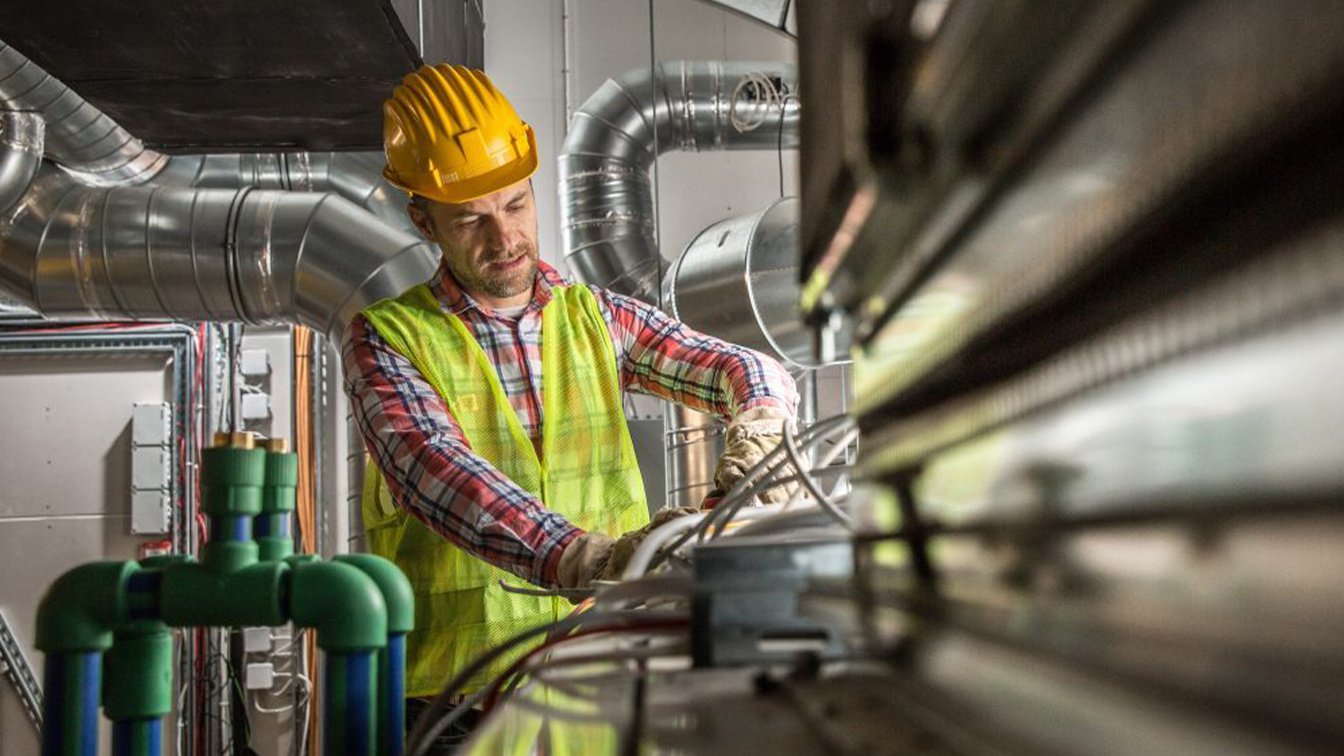 HVAC engineer inspecting a system