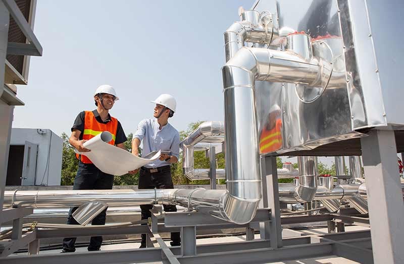 HVAC engineers supervising a site in progress