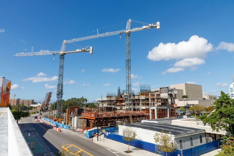 High-rise building construction site with cranes by Kaw Valley Engineering